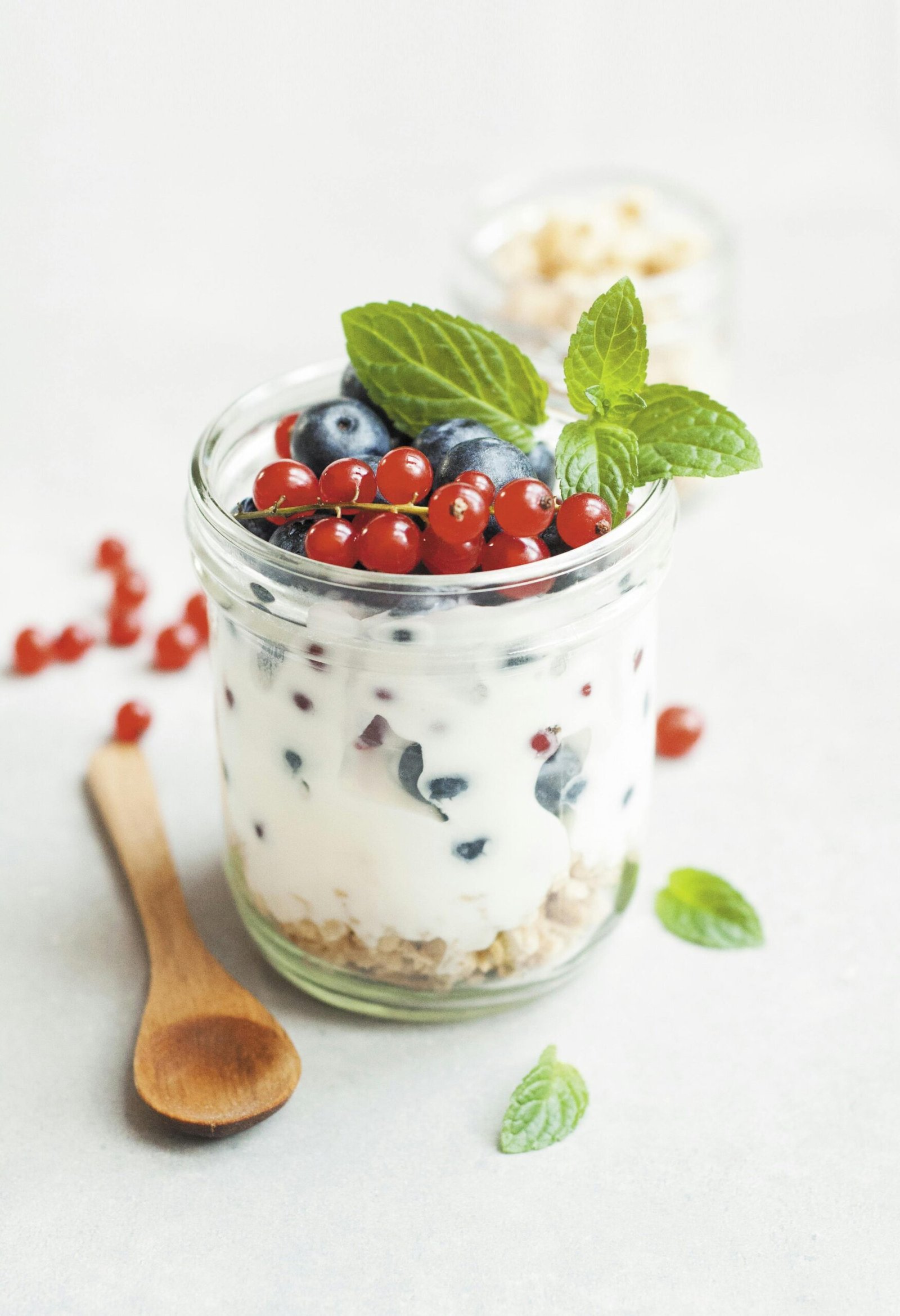 Home A delicious yogurt parfait with fresh berries and mint leaves, perfect for a healthy breakfast.